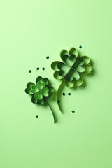 St Patrick's Day flat lay composition. Saint Patricks Day green background with paper cut four leaf...