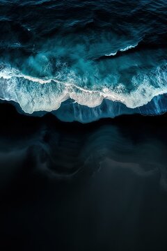 Mesmerizing Aerial Ocean Waves Crashing on Dark Beach