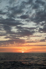 Ocean Sunset with Vibrant Sky and Clouds