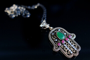 Hamsa hand or hand of Fatima. Religious symbol on a rock. Islam.  Kuala Lumpur. Malaysia.