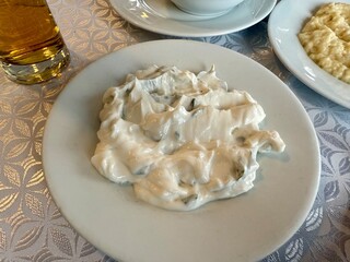 Raki appetizer Haydari is a type of yogurt made from certain herbs and spices, combined with garlic. Turkish cuisine served at fish restaurant