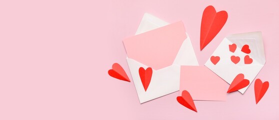 Envelopes with blank cards and paper hearts on pink background with space for text. Valentine's Day celebration
