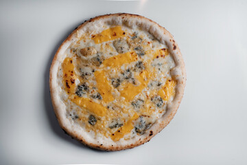pizza four cheeses on grey background