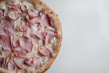 pizza with ham on white background close-up