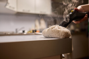 Achieving Efficient and Thorough Cleaning with a Steam Cleaner in a Modern Kitchen Setting