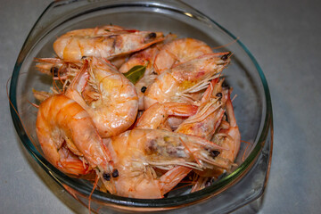 large king prawns, verine, pink, bent tails, macro, bay leaf, in a clear glass pan, seafood, food, delicious, dish
