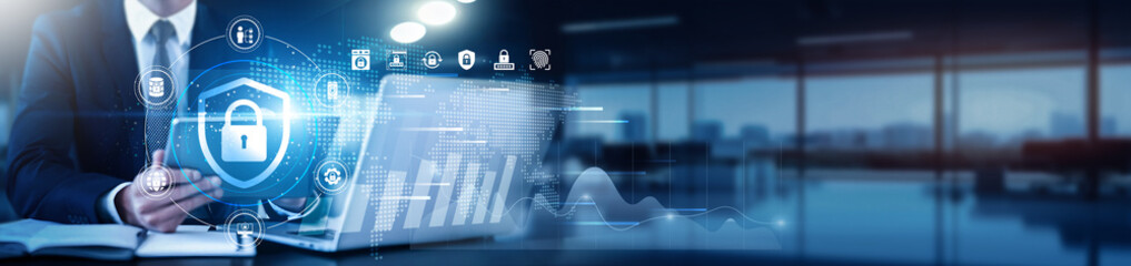 Cybersecurity expert using a tablet with a digital interface overlay showing network security, threat detection, and technology graphs firewall, encryption, intrusion, risk assessment, data breach.