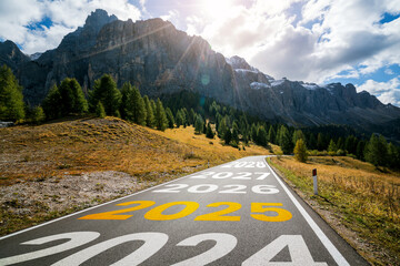 2025 New Year road trip travel and future vision concept . Nature landscape with highway road...