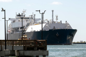Massive LNG Tanker  at Port with Industrial Background © Robert