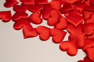 A sea of red hearts on a white background.