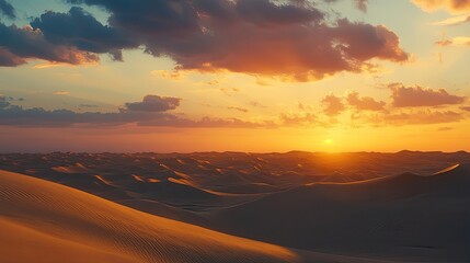 Obraz premium A stunning desert landscape at sunset, with golden sand dunes and a colorful sky filled with dramatic clouds,