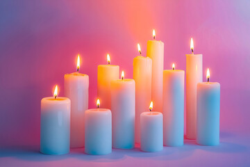 A group of white candles sitting on top of a table