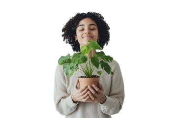 Woman holding a green potted plant against a white background showcasing a connection to nature and indoor gardening