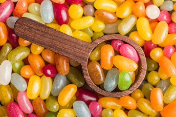 Multicolored jelly beans with various flavors in scoop. Top view.