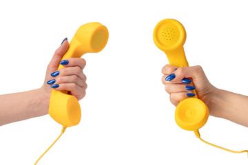 Yellow handset in woman hand isolated on white. Copy space.