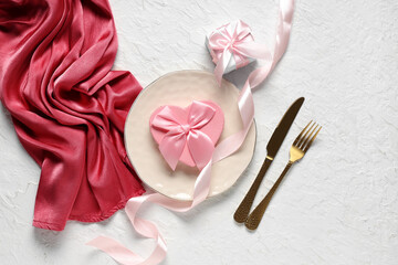 Beautiful table setting with gift boxes on white background. Valentine's Day celebration