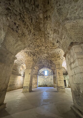 Split, Croatia - July 1, 2024: Historic Diocletian Cellars and palace. bowed ceilings supported by thick stone pillars