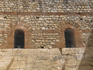 Split, Croatia - July 1, 2024: Historic Diocletian Cellars and Palace. Upper level outside. Restored niche doorways and air vent in ancient stone wall