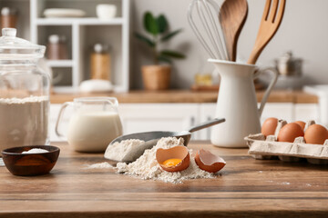 Utensils and ingredients for preparing dough on kitchen counter