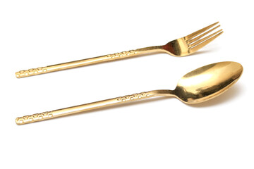 Perspective view of Golden Cutlery set isolated white background