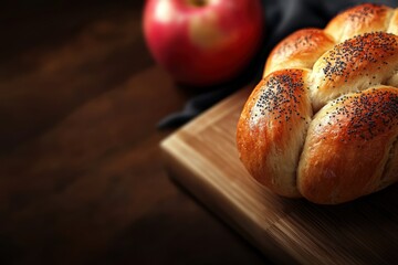 Freshly baked Challah bread loaf with spoppy seeds on a rustic wooden cutting board.