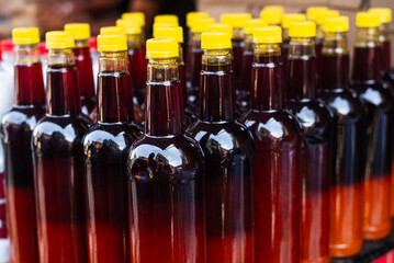 Palm oil in a plastic bottle for sale at a fair. Rich in vitamin A.
