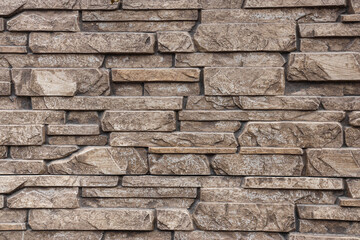 Texture of brown brick wall as background, closeup