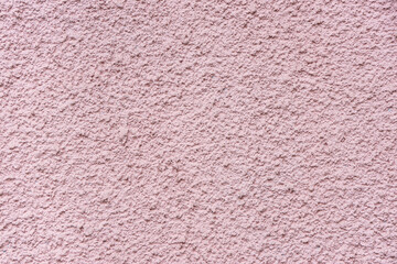 Texture of pink concrete wall as background, closeup