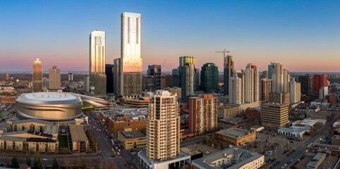 Edmonton skyline at twilight, showcasing modern high-rises and construction. Urban landscape., Alberta, Canada