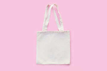 White cotton, canvas, tote, mesh bag on pastel pink background. Zero waste, no plastic, eco...