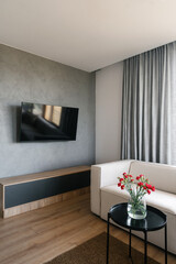 Modern living room with minimalist design and cozy ambiance in urban apartment