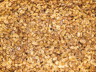 Detailed macro shot of granola with oats, seeds, and nuts. Perfect for breakfast, healthy eating, or food-related designs