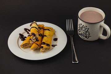 Gingerbread heart decorated with red bow on rustic wooden table