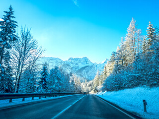 Mountain road in winter in Austrian Alps with snow