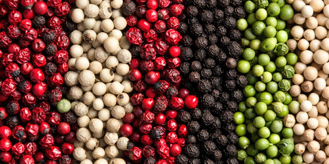 Black, white, green, and pink peppercorns. Lots of Different pepper corn texture background