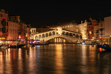 Rialto Bridge over Venice Grand Canal at night