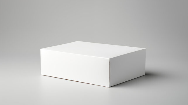 Bo&icirc;te blanche en carton pos&eacute; sur un fond neutre. Mock-up pour marque, entreprise. Objet, colis, emballage. Commerce, entrep&ocirc;t. Pour conception et cr&eacute;ation graphique.