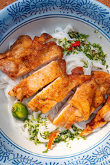 top view Thai-style chicken with stir-fried Ho Fun or rice noodles at vertical composition
