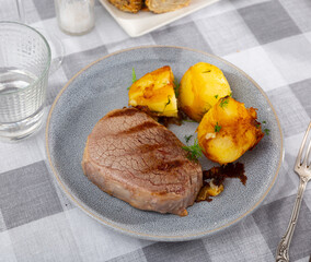 Appetizing grilled beef with delicious fried potatoes