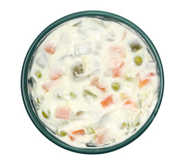 Homemade french salad with mayonnaise in bowl isolated on white, top view