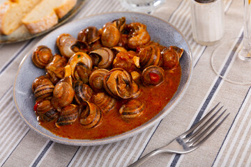 Snails tapa - Andalusia traditional food on table closeup