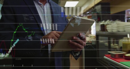 Image of financial data processing over caucasian man using tablet