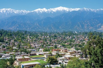 Mountainous town landscape, scenic valley view, Himalayan backdrop, travel destination