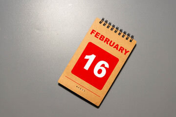 February 16th. Day 16 of february month, calendar on yellow background.