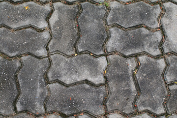 Grungy Worm bricks platform, pavement floor texture background. Street walk way.
