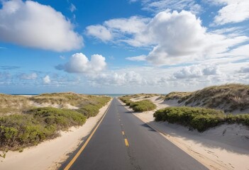 Scenic Beach side Road Under a Vast Cloudy Blue Sky