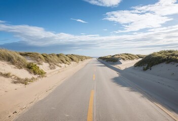 Empty Coastal Road with Expansive Sky and Dunes
