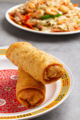 two spring rolls and chop sue dishes