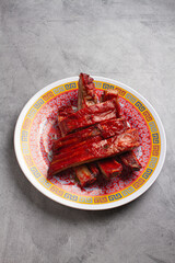 chinese style bbq pork ribs on marble background