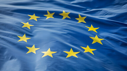Close-up of a waving European Union flag, stars, blue, yellow, fabric, texture